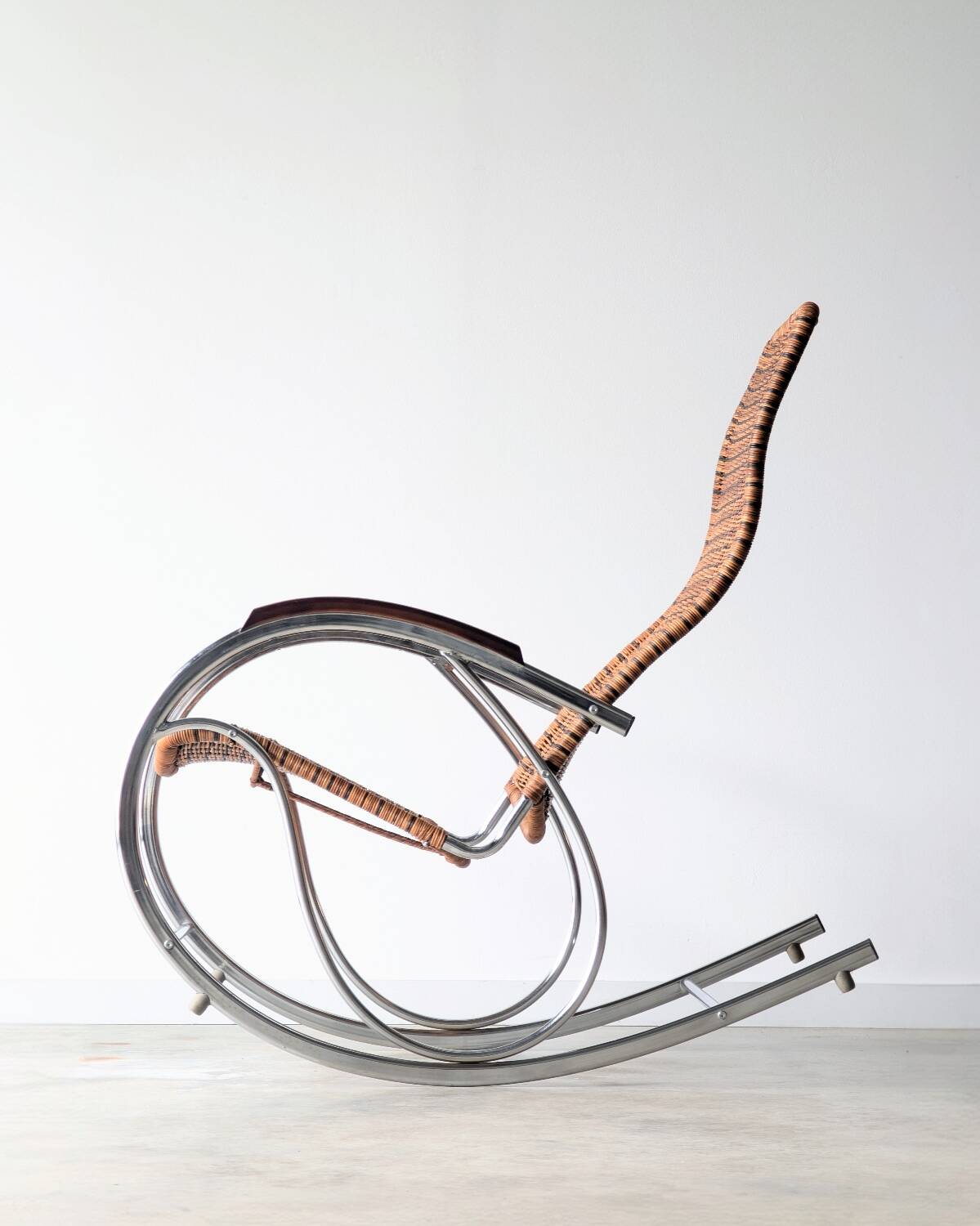 Vintage Thonet rocking chair in chrome and rattan, 1970.
