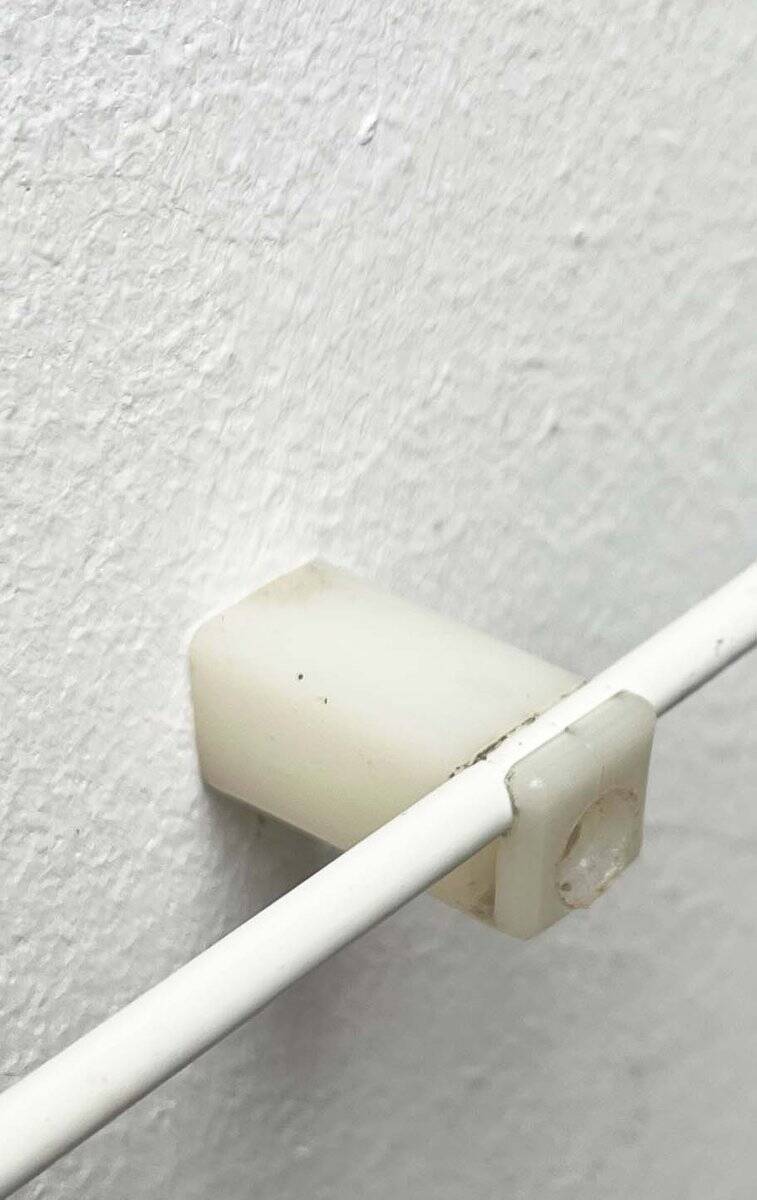 Minimalist white German mid-century coat rack with strings from the 1960s.