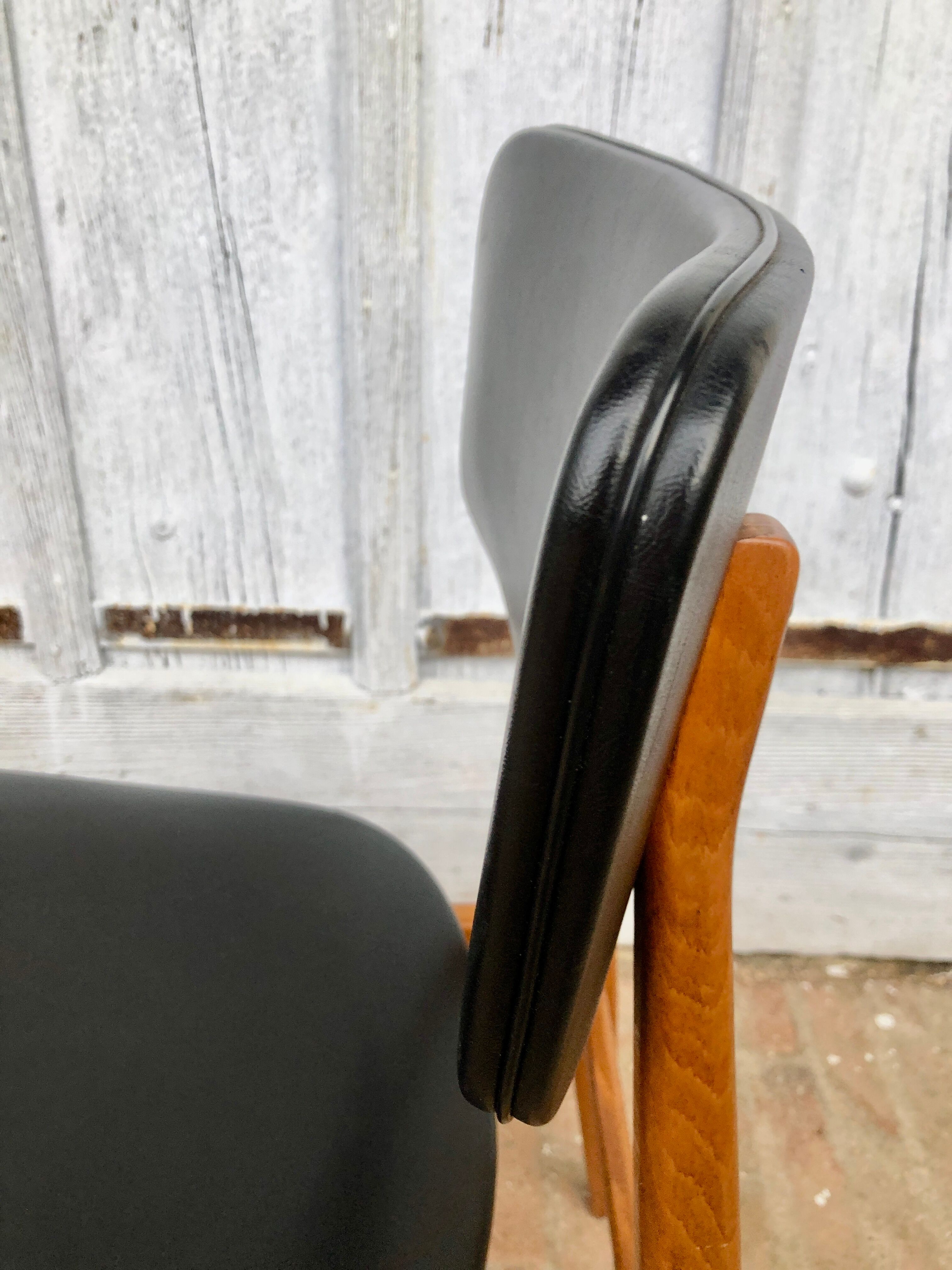 Set of 4 Scandinavian teak and black skai chairs