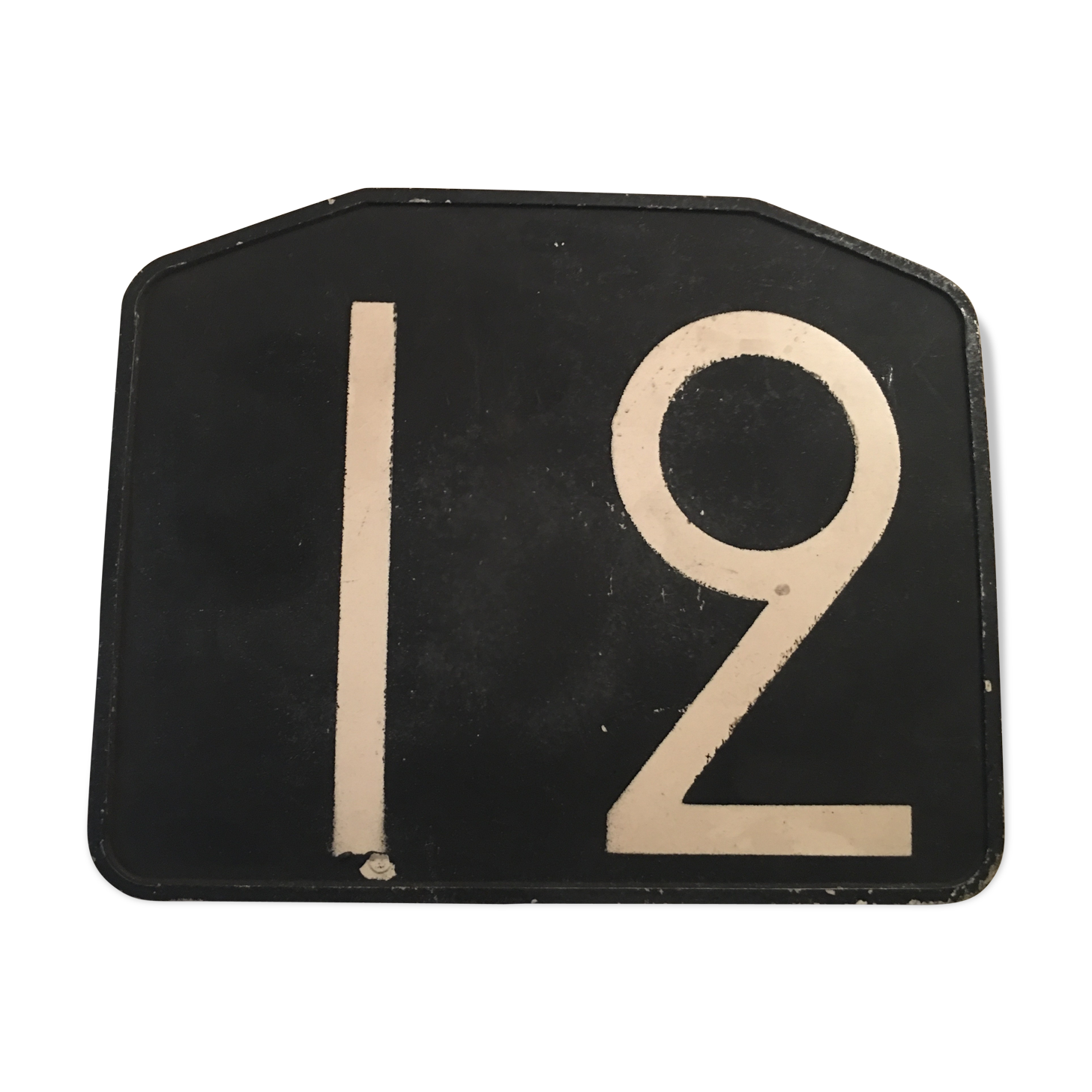 Old plate of bakelite, no. 12 bus line.