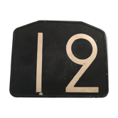 Old plate of bakelite, no. 12 bus line.