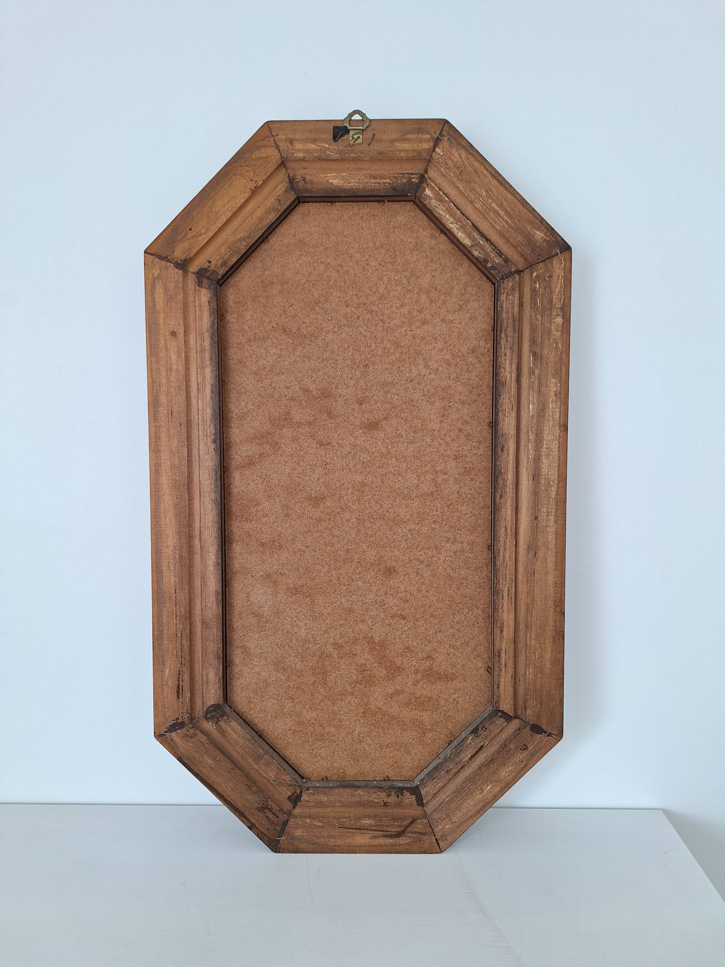 Octagonal wooden mirror from the 1980s.