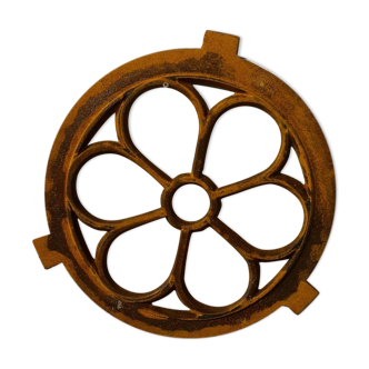 Cast iron ox's eye window in the shape of a flower