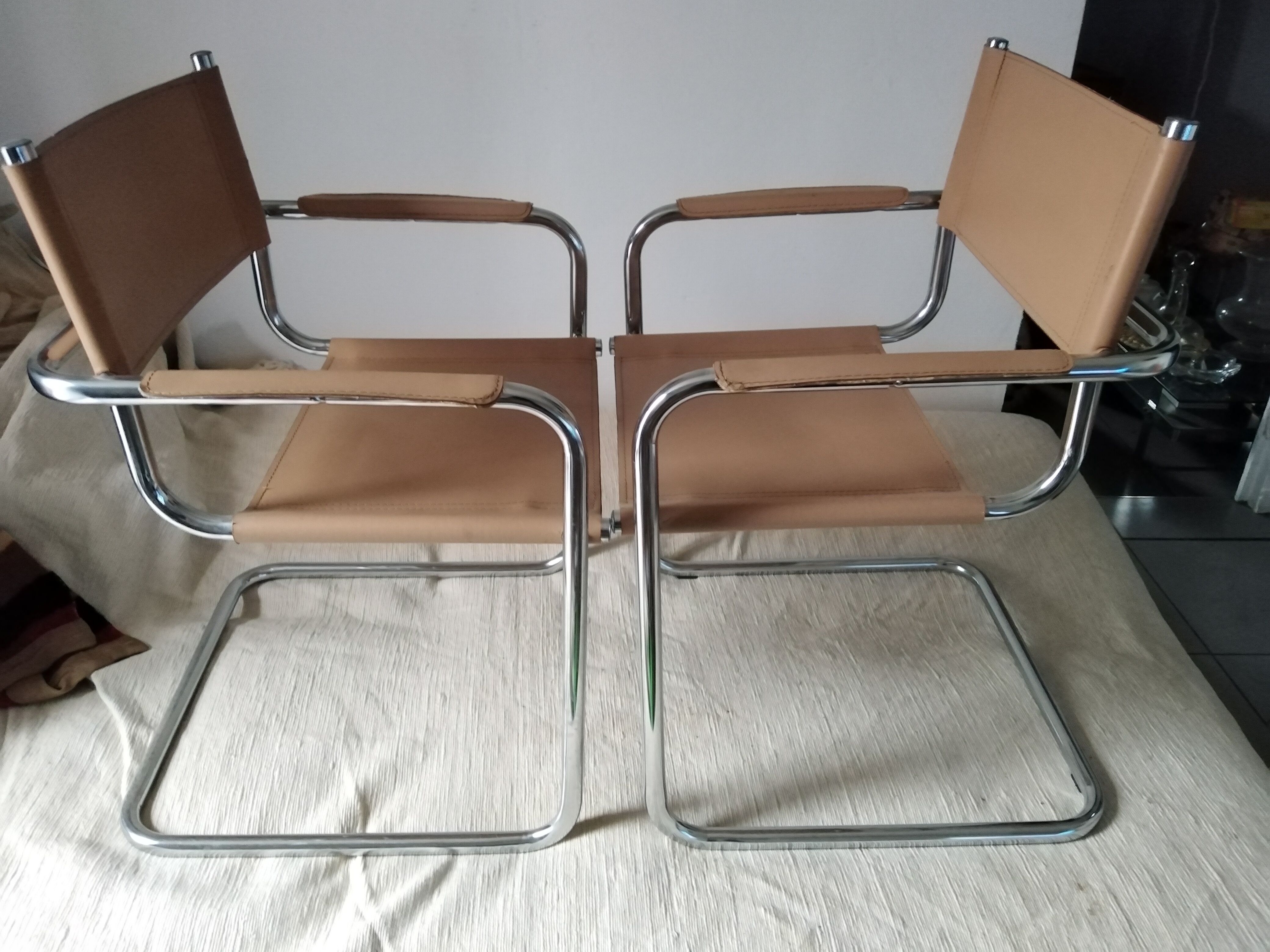 Pair of leather and chrome armchairs
