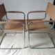 Pair of leather and chrome armchairs