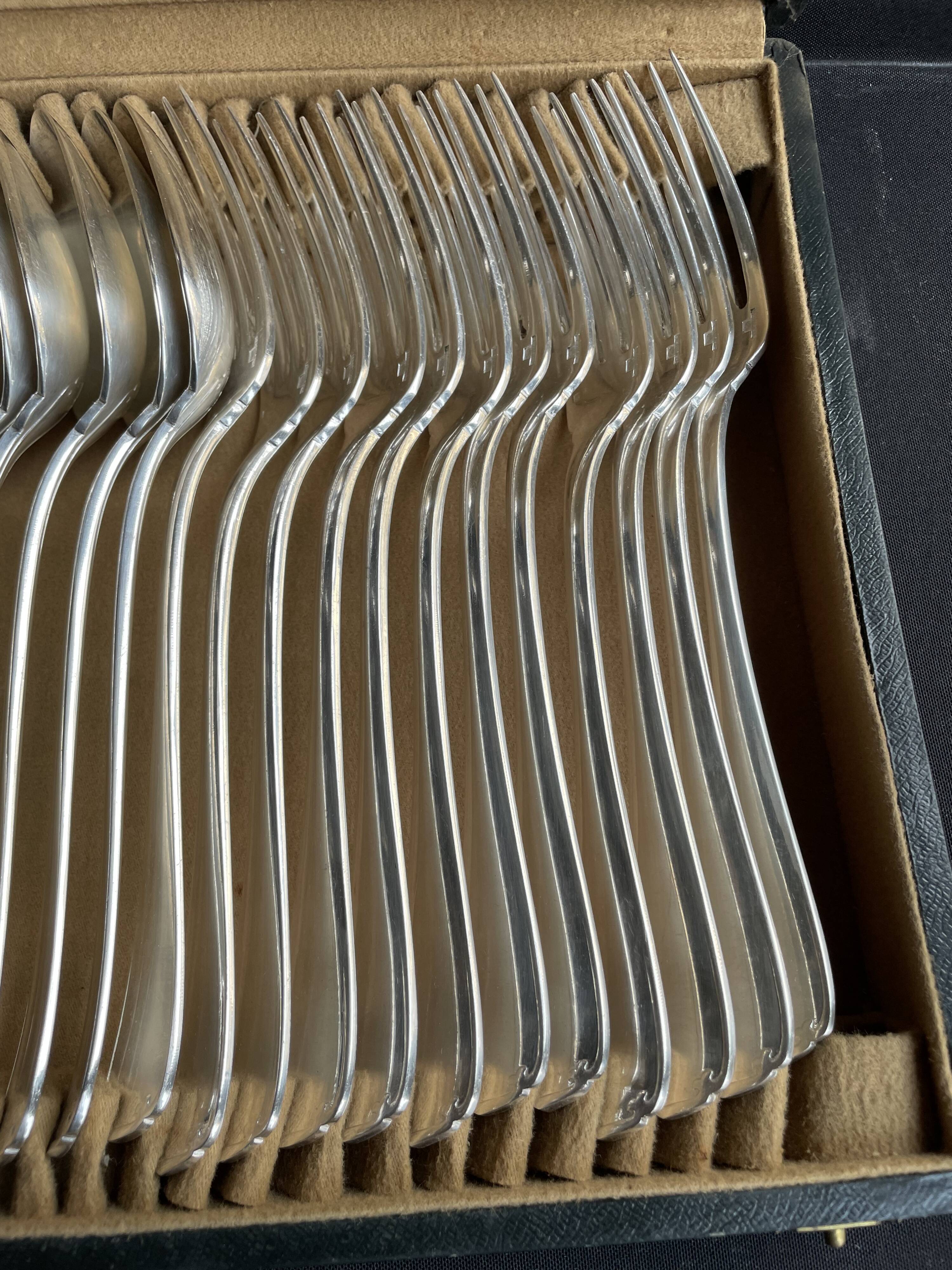 12 Christofle table forks and 12 spoons