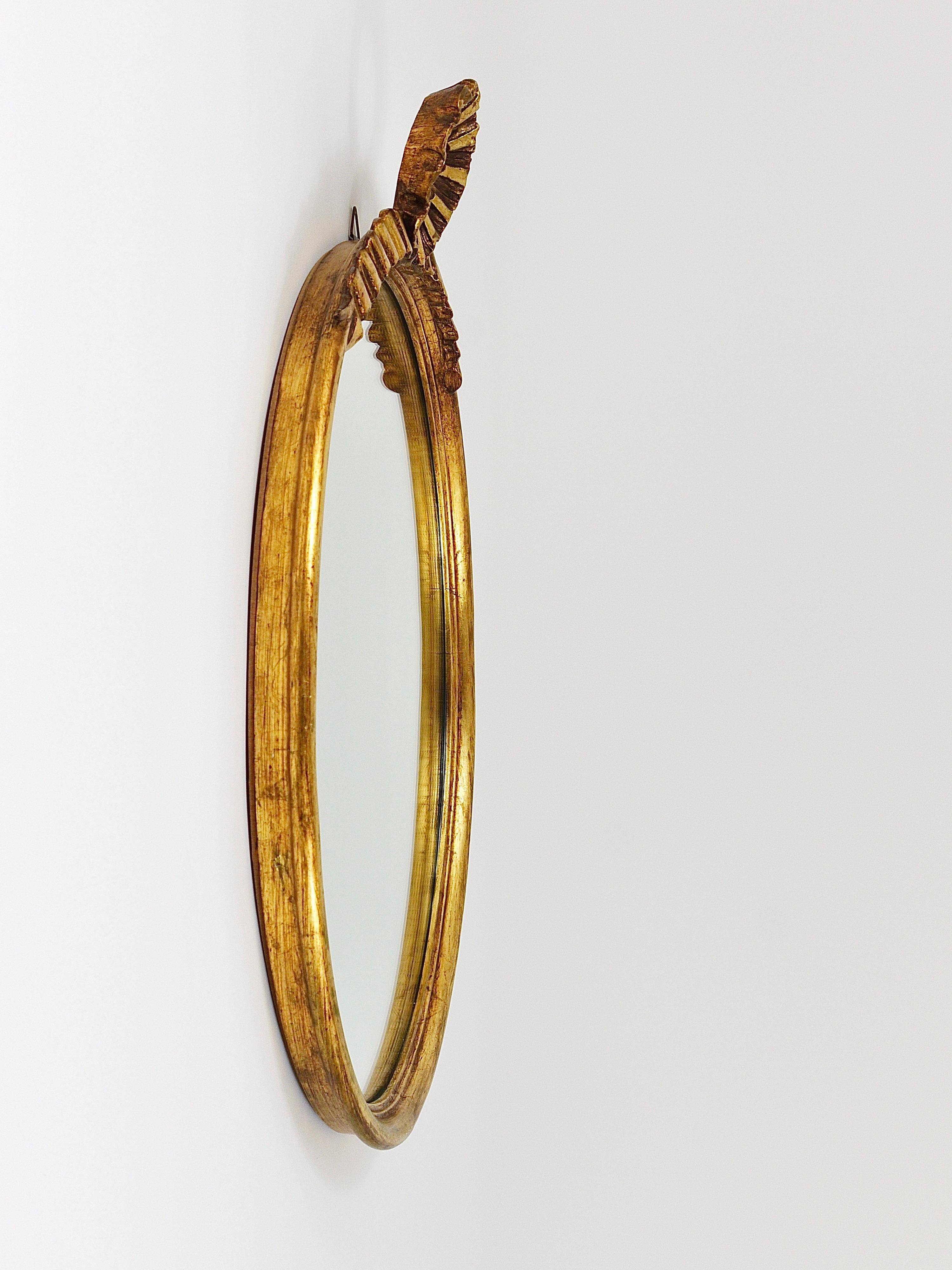 Round wall mirror in gilded wood, mid-century, C. Allodi & G. Subelli, Italy, 1950s.