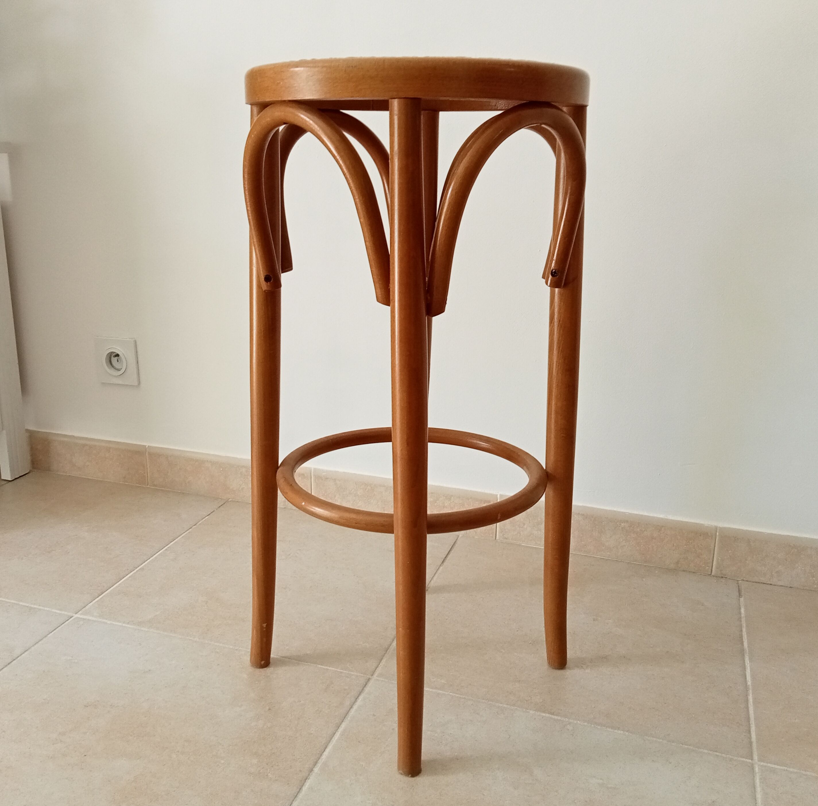 Vintage curved wooden high stool and tanned seat