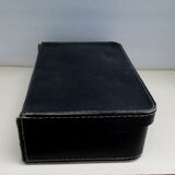 Small suitcase in old navy blue cardboard