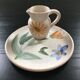 Set plate and jug with floral decoration.