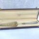 Shovel a cake in silver metal and brass