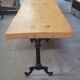 Large bistro table with a wooden top and cast iron legs - 2m56