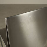 Set of six postmodernist stainless steel dining chairs from circa 1980-1990.