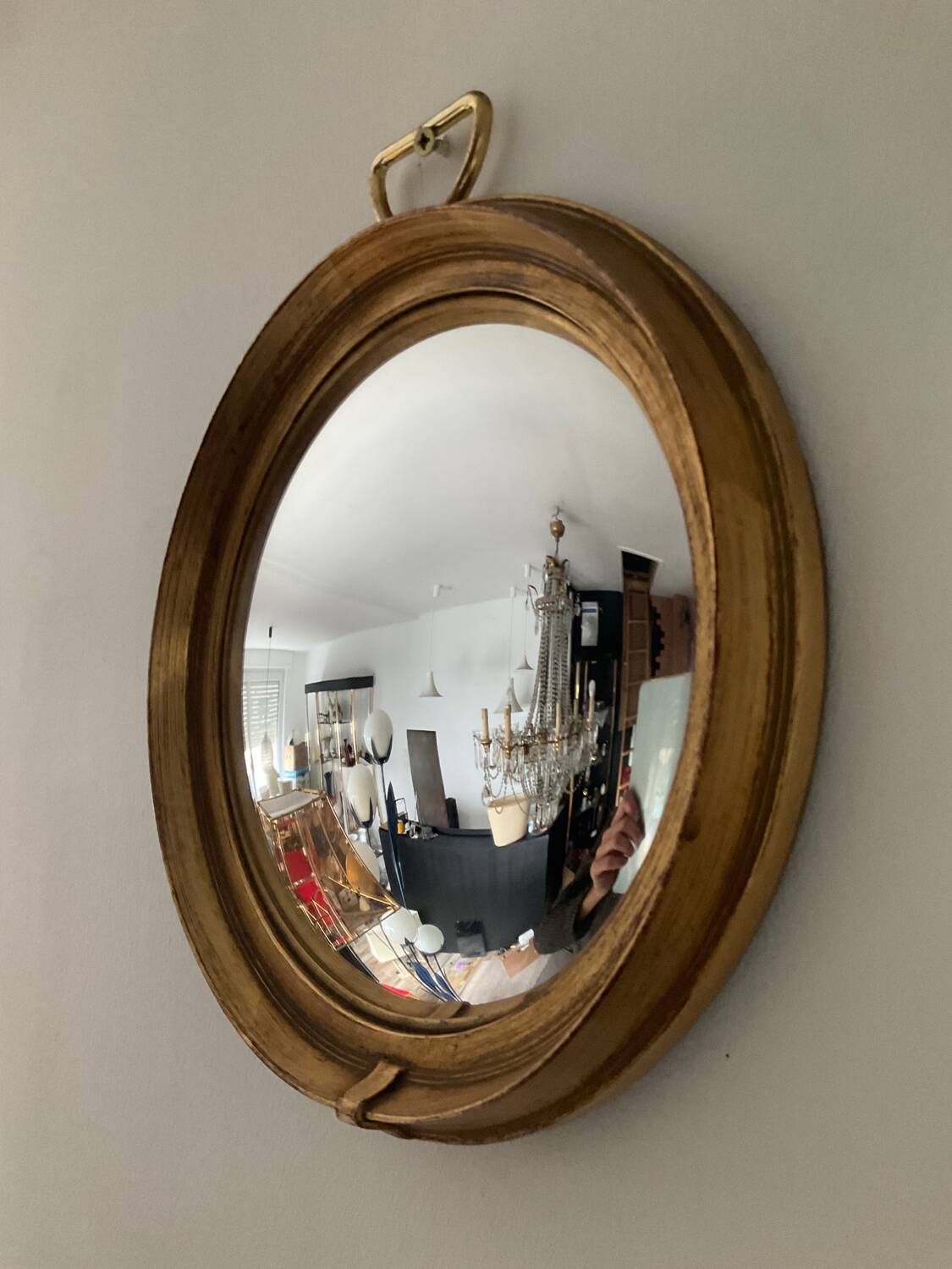 Vintage witch's eye mirror in gilded wood