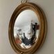 Miroir œil de sorcière vintage en bois doré
