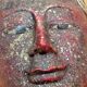 Hanging mask with Buddha face, carved polychrome wood