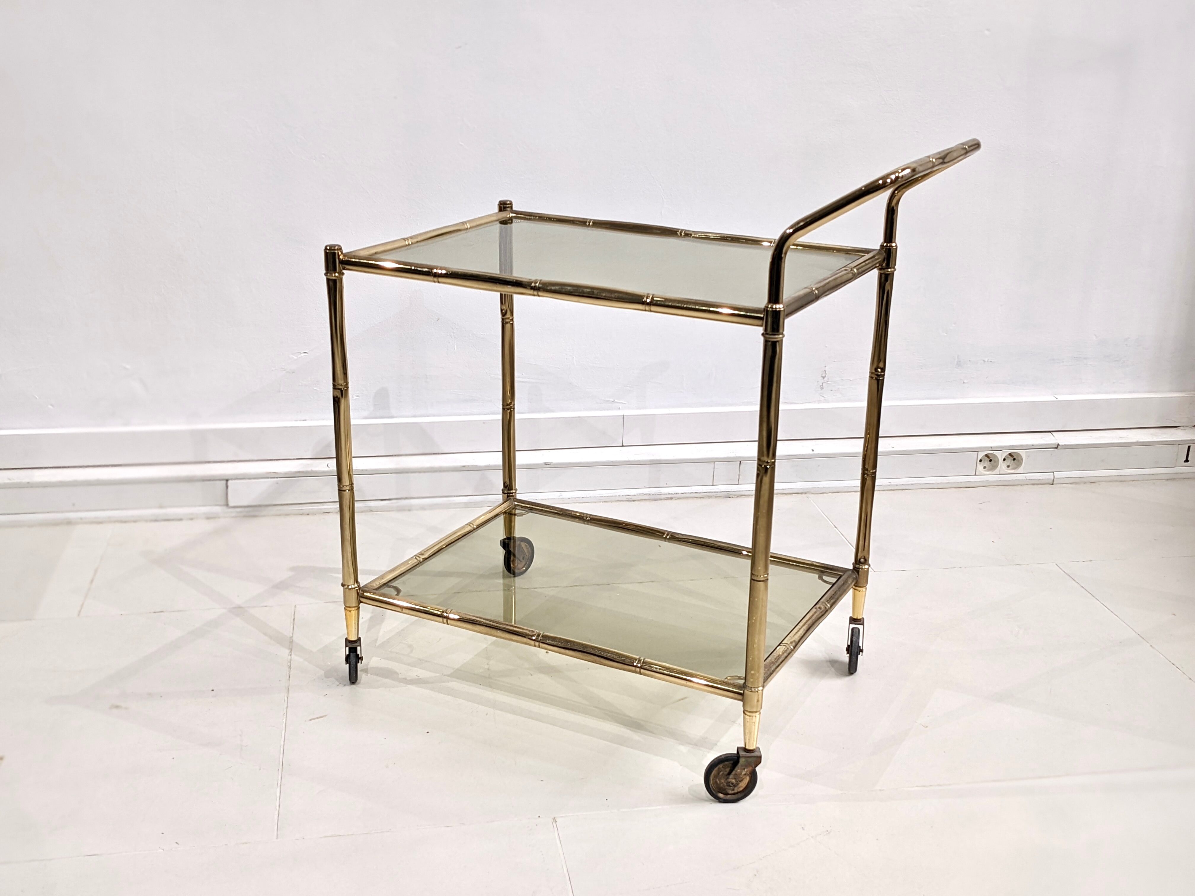 Golden metal dessert with tinted glass tops