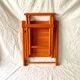 Vintage folding chair in orange painted wood