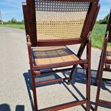 Set of 2 folding chairs in wood and cane.