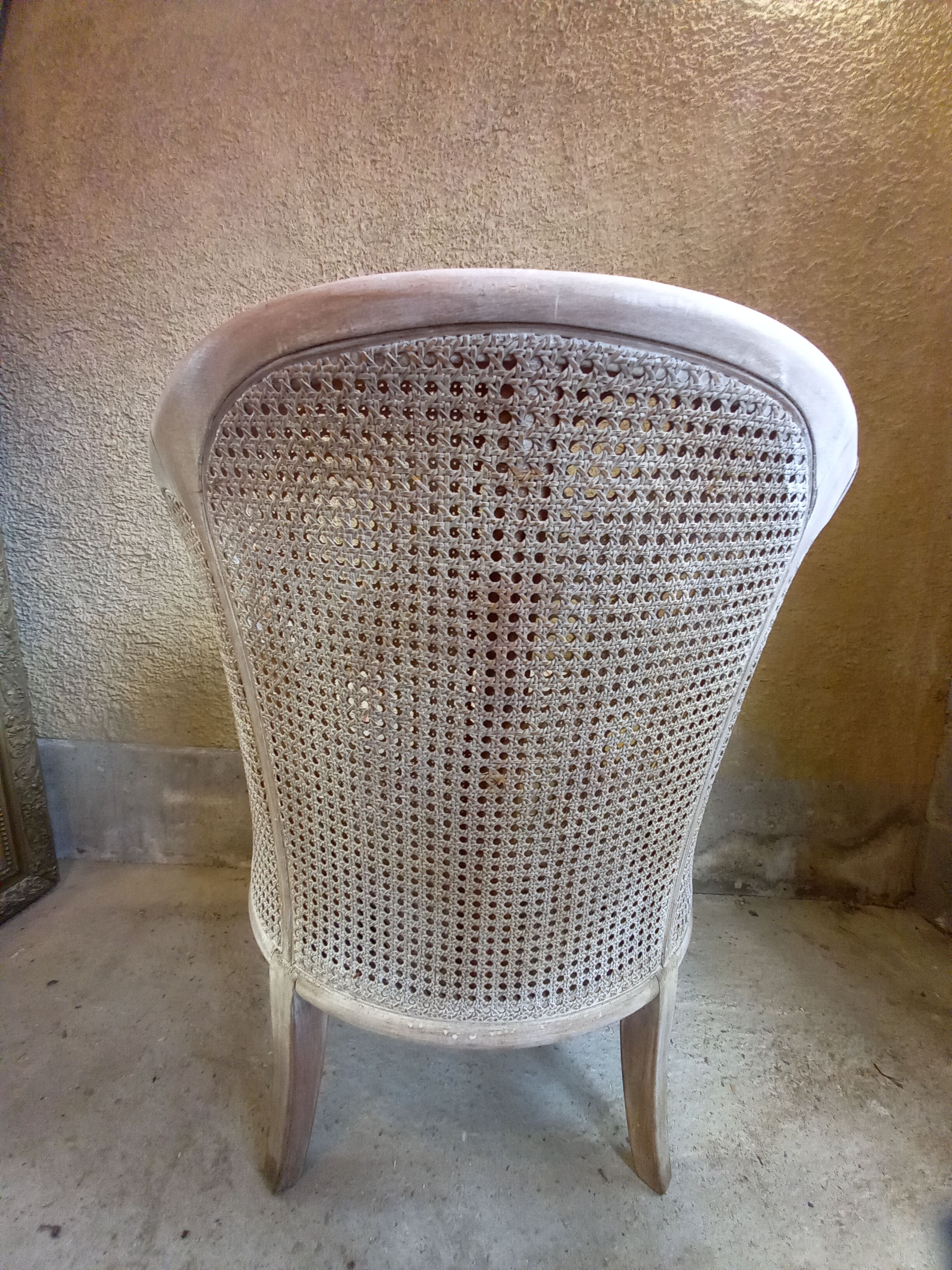 Canned basket armchair