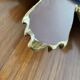 Vintage sun mirror in golden resin 60s/70s