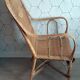 Fauteuil vintage en rotin tressé.