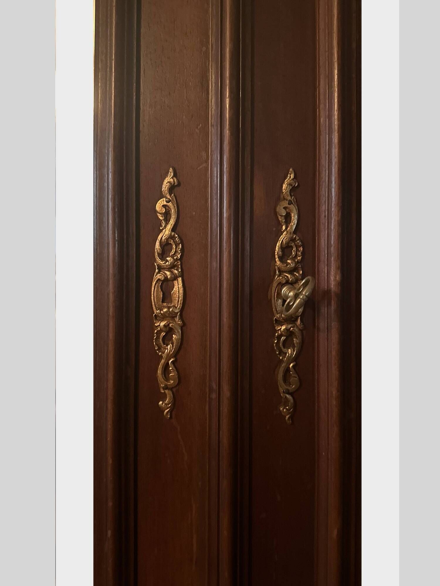 Louis XV style armoire with two bevelled mirror doors.