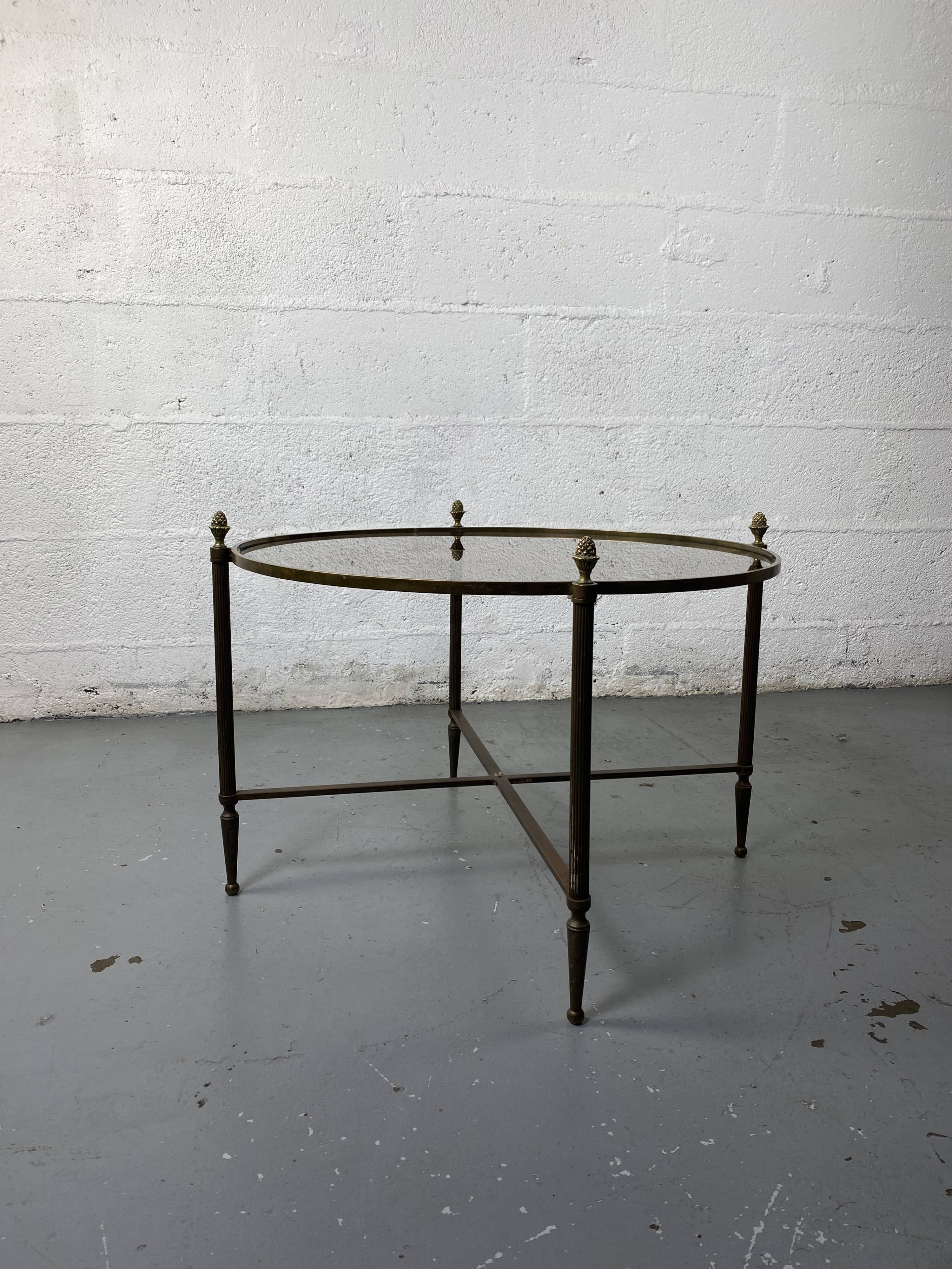 Round coffee table in brass and smoked glass