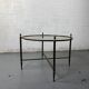 Round coffee table in brass and smoked glass