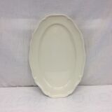 Old ivory-colored, oval-shaped dish with chamfered edge