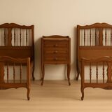 2 beds and a vintage bedside table in solid cherry wood
