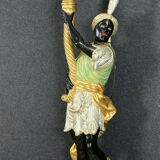 Early XXth era polychrome wooden torch has figuration of a Moor in traditional costume from the 18th