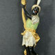 Early XXth era polychrome wooden torch has figuration of a Moor in traditional costume from the 18th