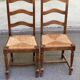 2 dining chairs in solid wood and rush, Chippendale ladder style.