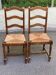 2 dining chairs in solid wood and rush, Chippendale ladder style.