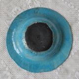 Empty turquoise raku pocket