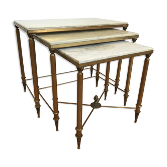 Pull-out tables in golden brass and marble