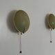 Pair of green plexiglass and gold metal wall lights by Erco, 1950s, Germany.