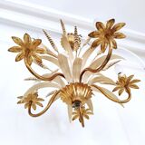 Vintage wrought iron chandelier decorated with golden and beige reeds
