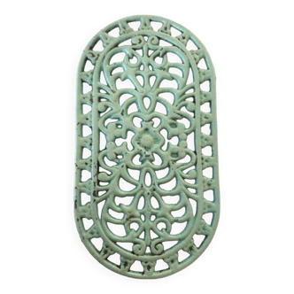 Old oval trivet in green enameled cast iron