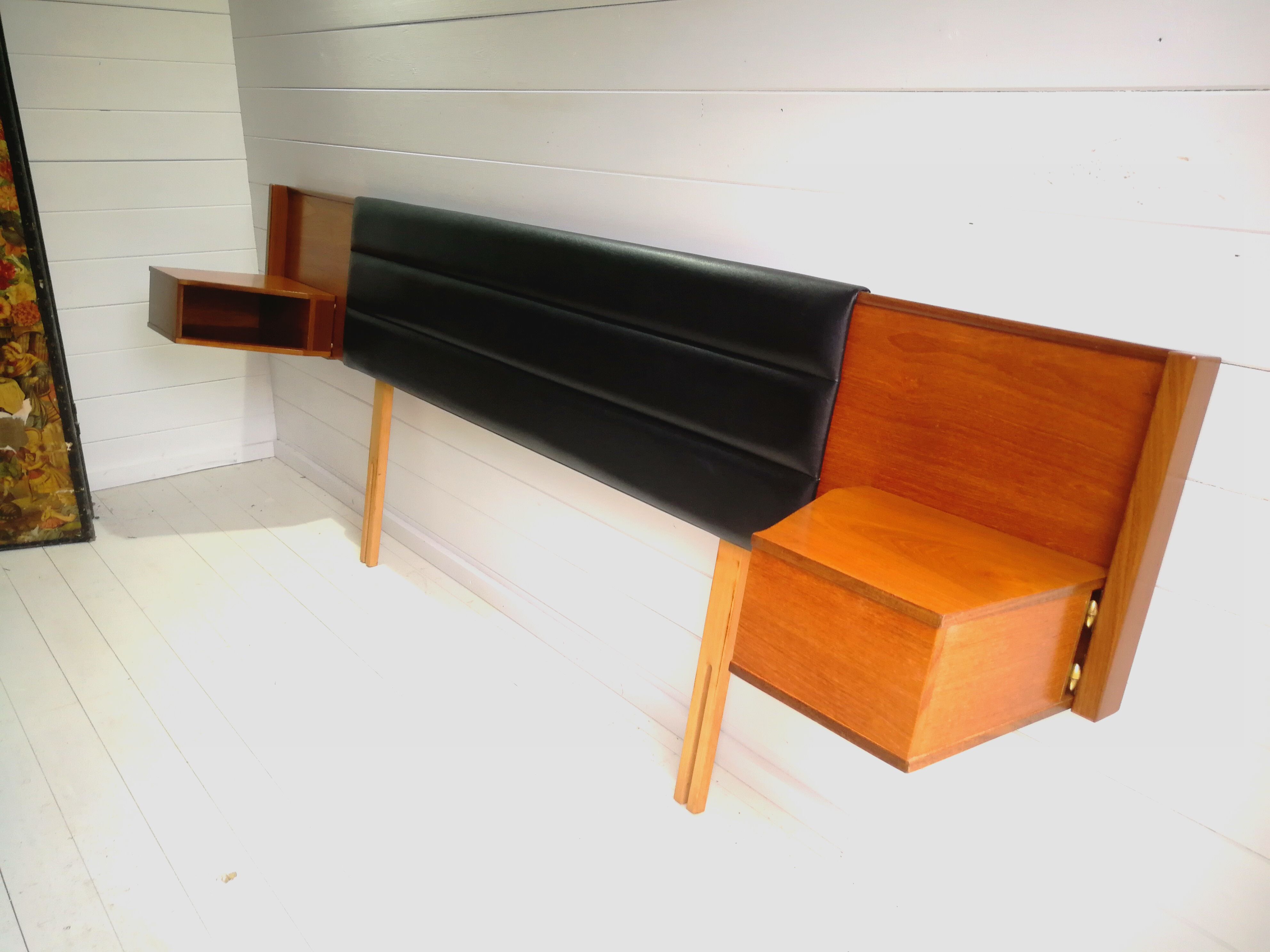 Mid century 1970s retro teak headboard with two hinged bedsides, upholstered in black by 'slumberlan