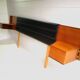 Mid century 1970s retro teak headboard with two hinged bedsides, upholstered in black by 'slumberlan