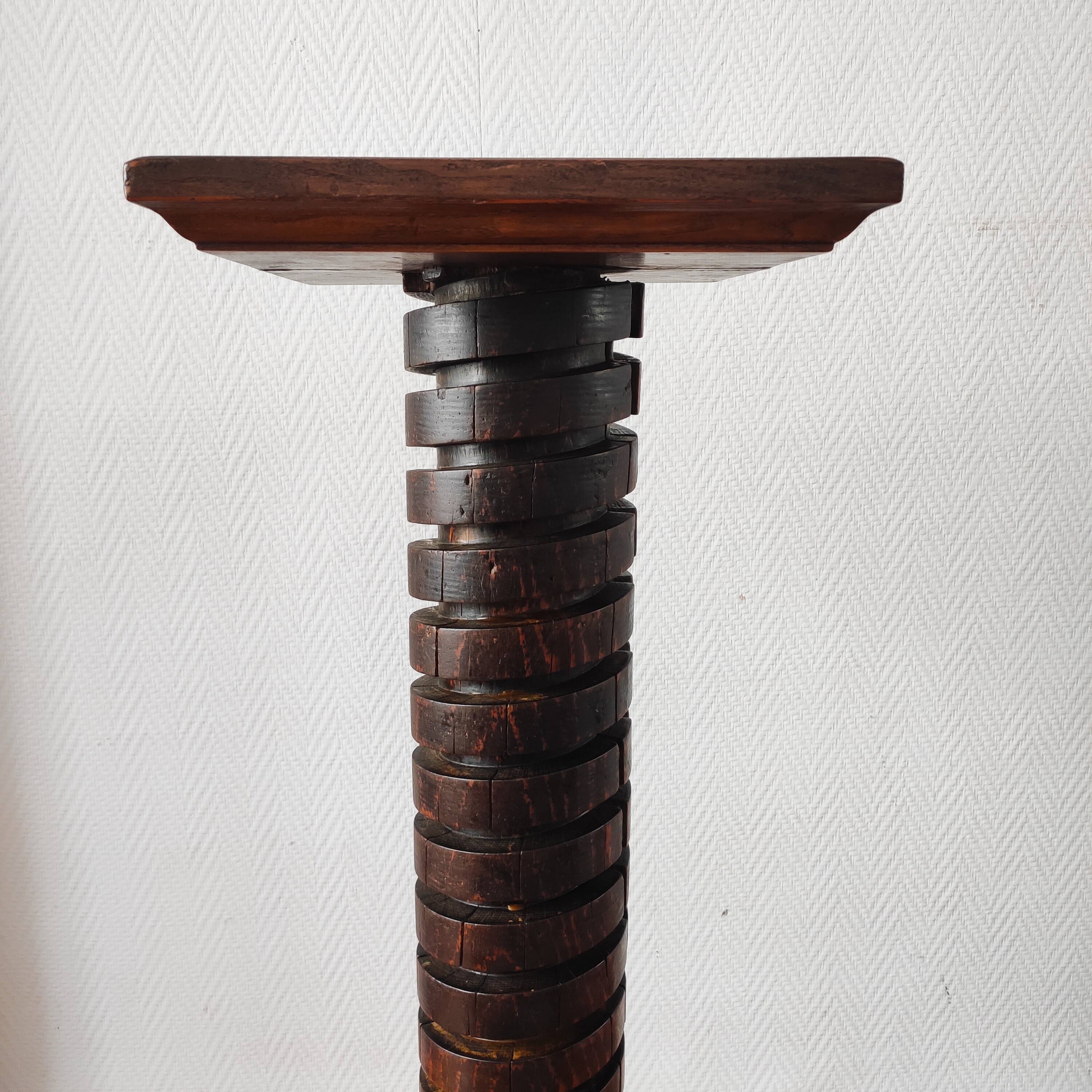 Brutalist column – old Burgundy press screw