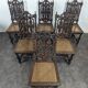 Set of 6 Henri II chairs in carved openwork oak with caned seats.