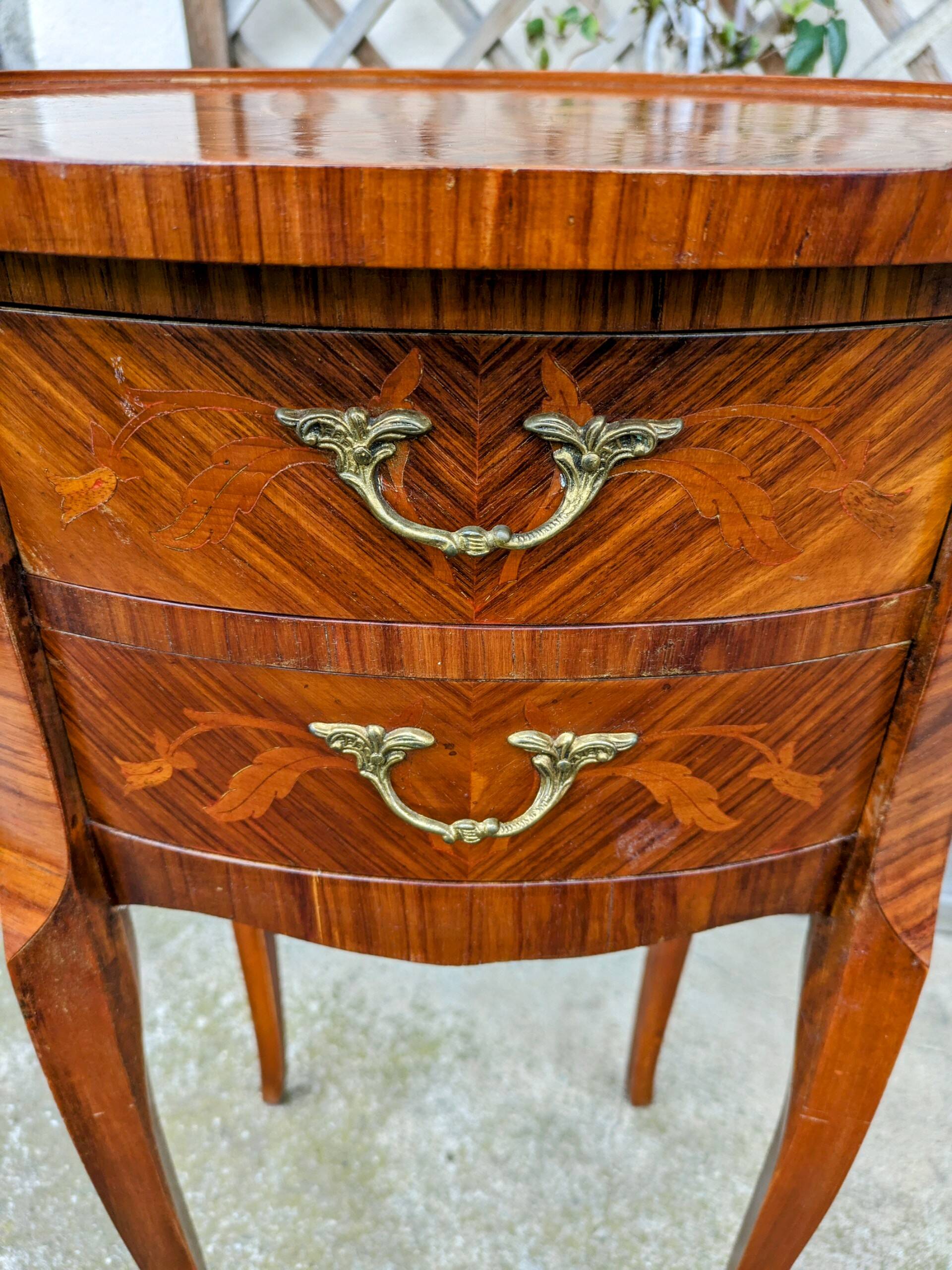 Old oval bedside table in rosewood marquetry Louis XV style