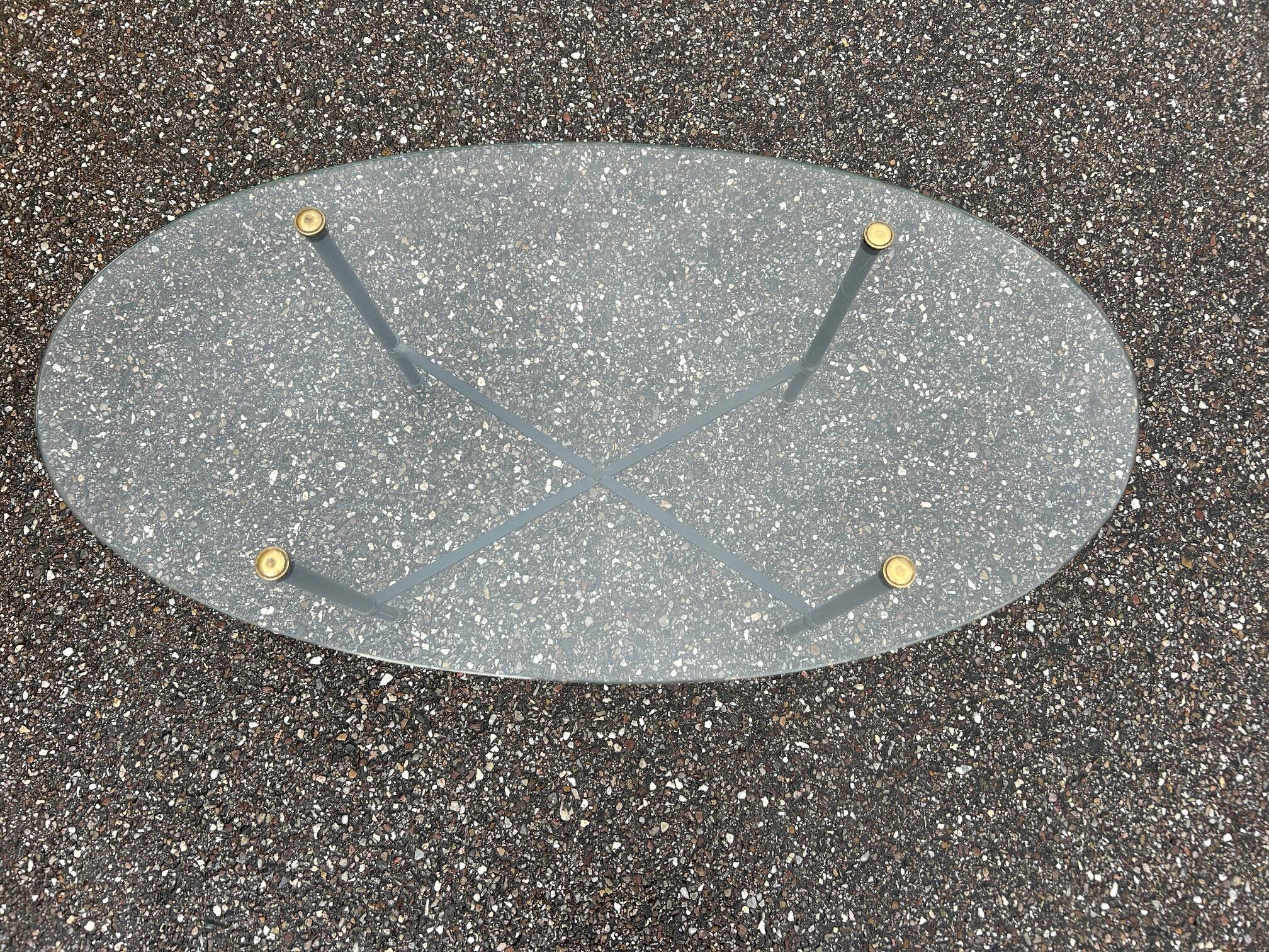 Oval glass and brass coffee table 1950