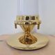 Pair of Hollywood Regency table lamps in brass with glass shades.