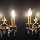 Pair of gilded bronze sconces and crystal pendants