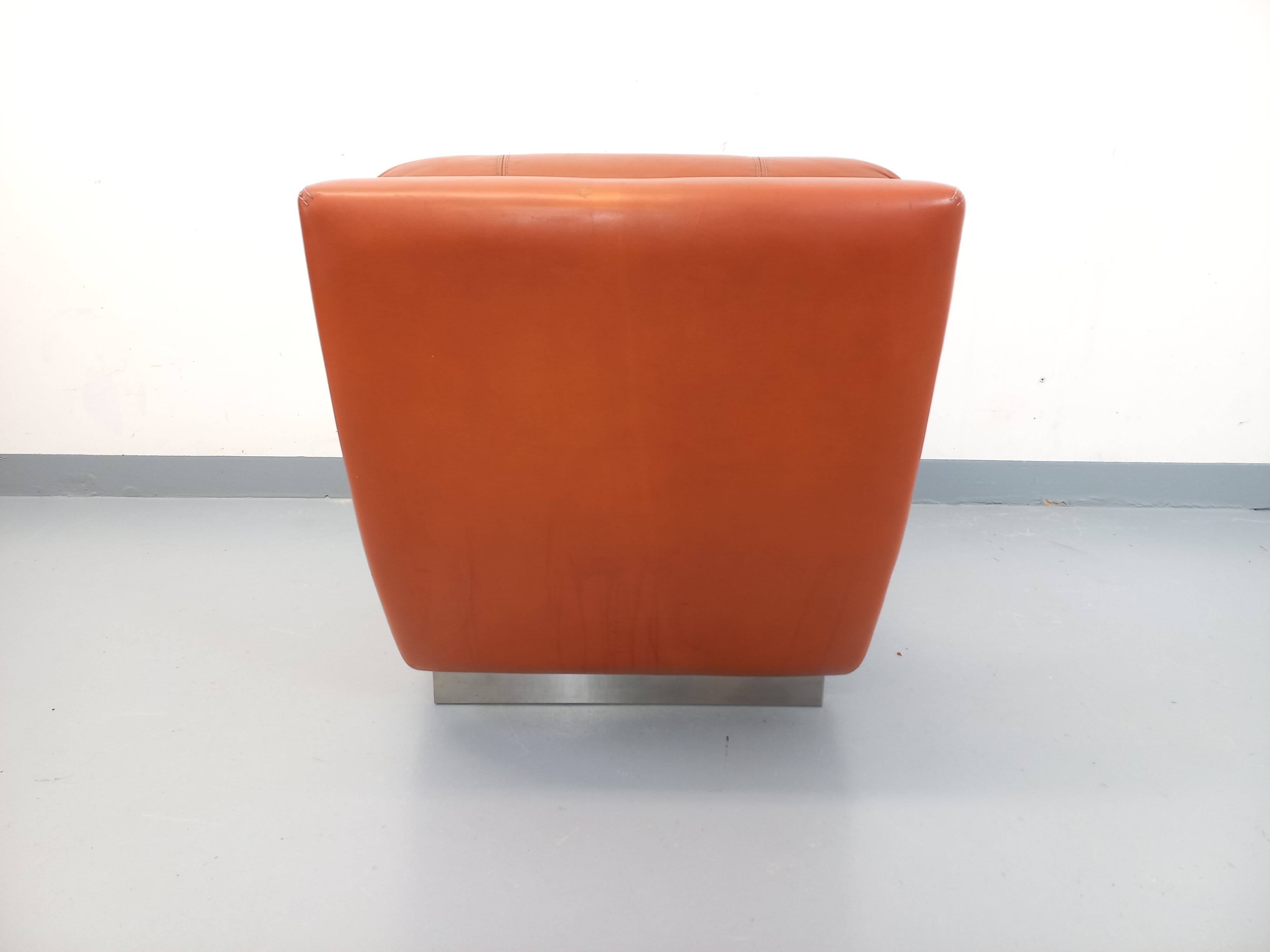 Vintage Roche Bobois armchair in chrome and terracotta leather.