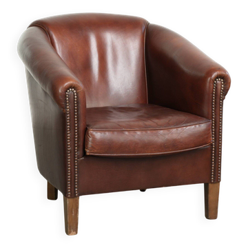 Sheepskin club armchair in English style with brown colour scheme
